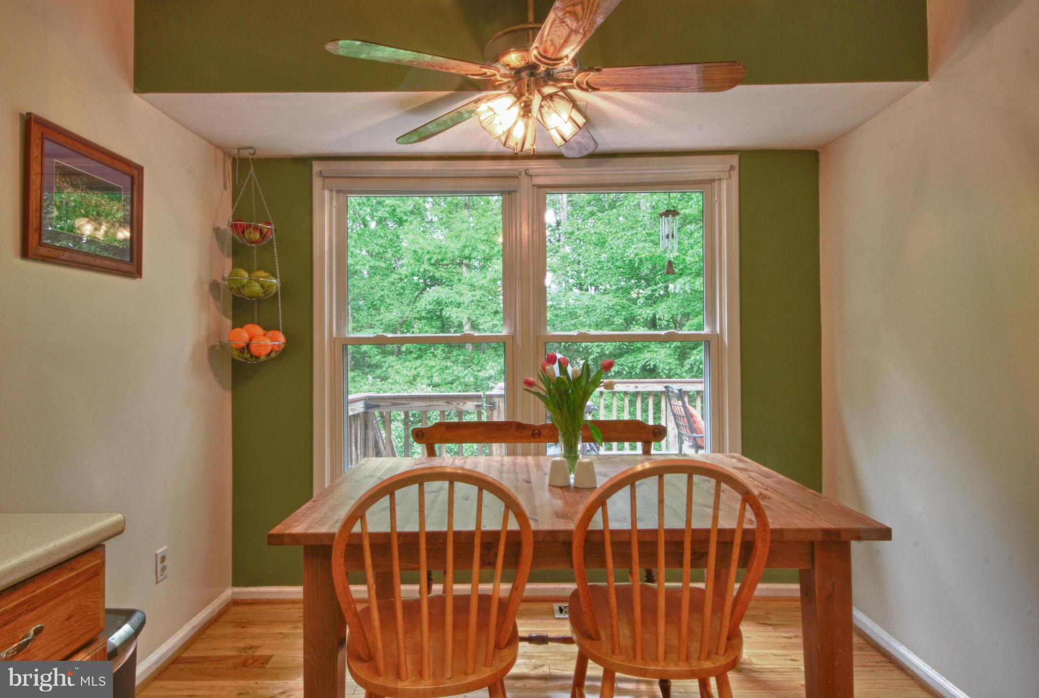 6285 Rathlin Drive Springfield, VA 22152 - Photo 7 of 18 a view of a dining room with furniture window and outside view