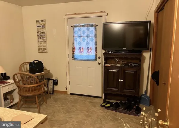 a room with furniture and gym equipment