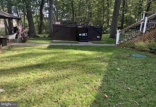 a view of a chairs in a backyard