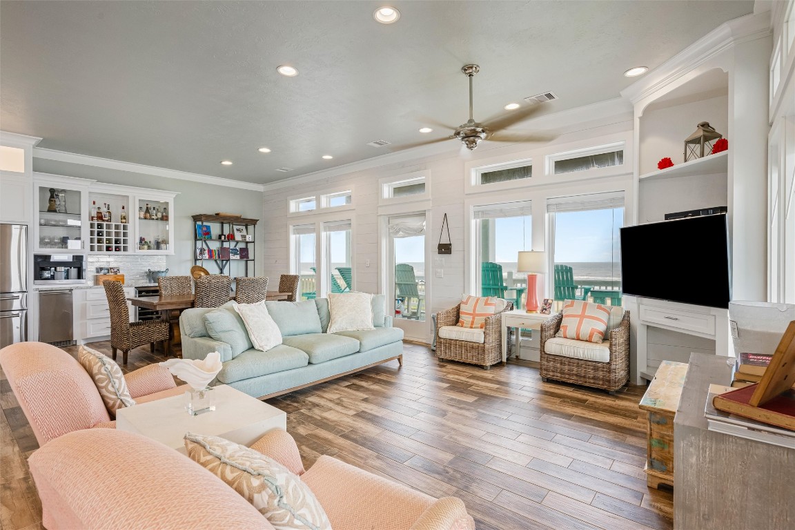 3116 James Street Crystal Beach, TX 77650 - Photo 11 of 47 a living room with furniture kitchen view and a flat screen tv