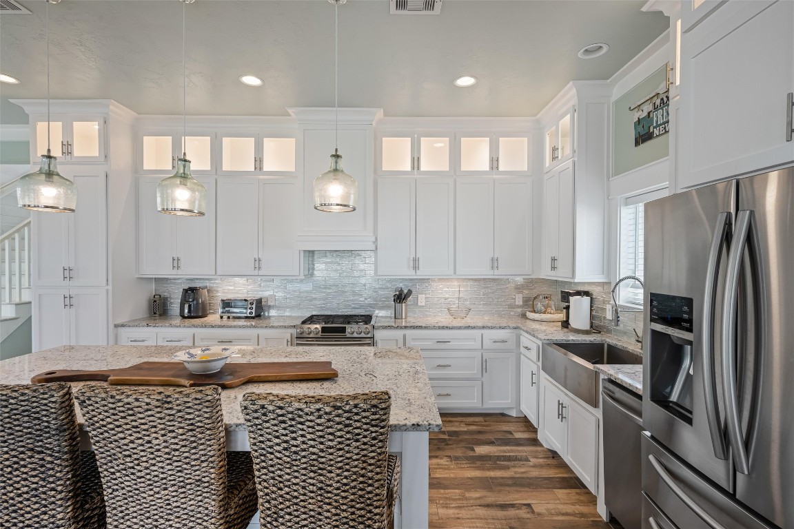 3116 James Street Crystal Beach, TX 77650 - Photo 17 of 47 a kitchen with a sink stainless steel appliances and cabinets