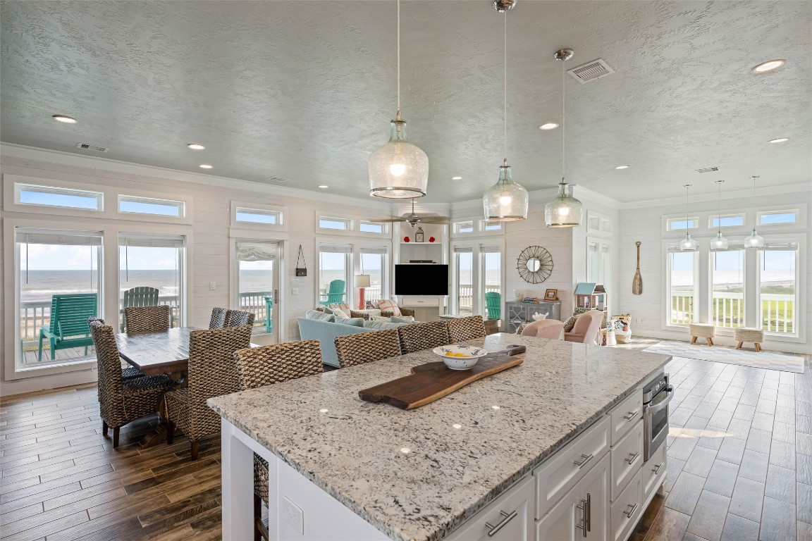 3116 James Street Crystal Beach, TX 77650 - Photo 18 of 47 a large kitchen with granite countertop a large island in the center