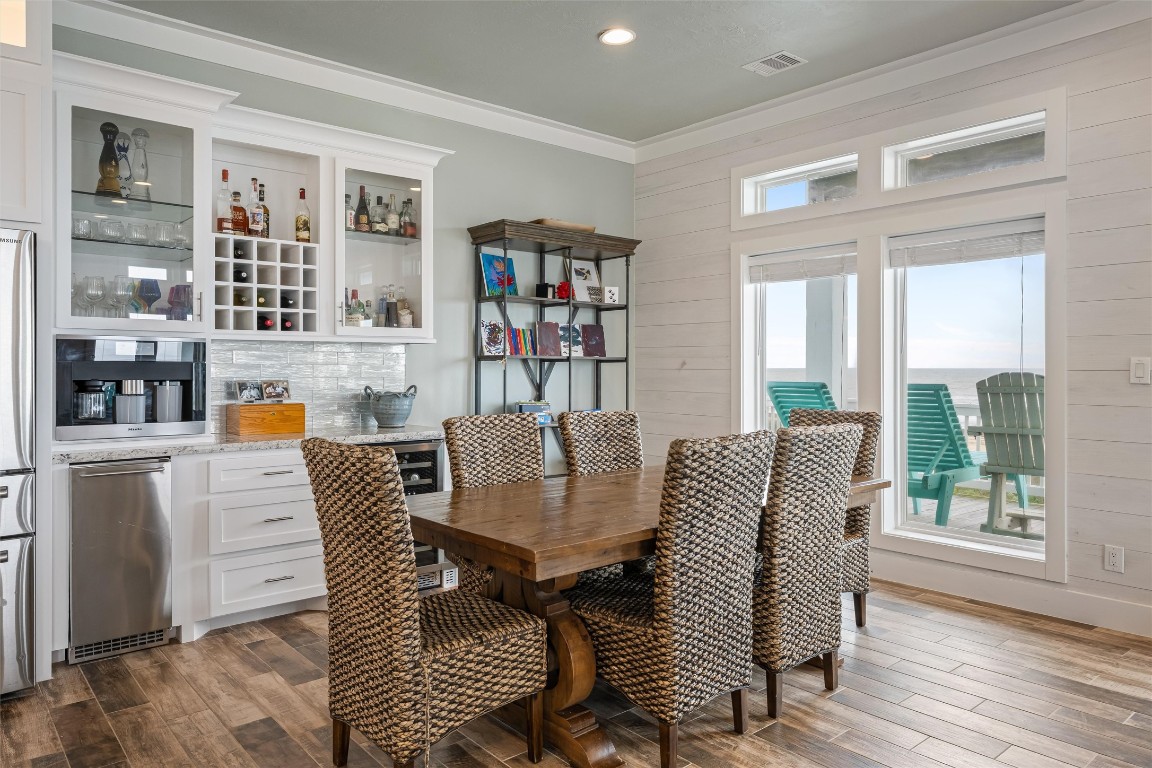 3116 James Street Crystal Beach, TX 77650 - Photo 21 of 47 a dining room with furniture and wooden floor