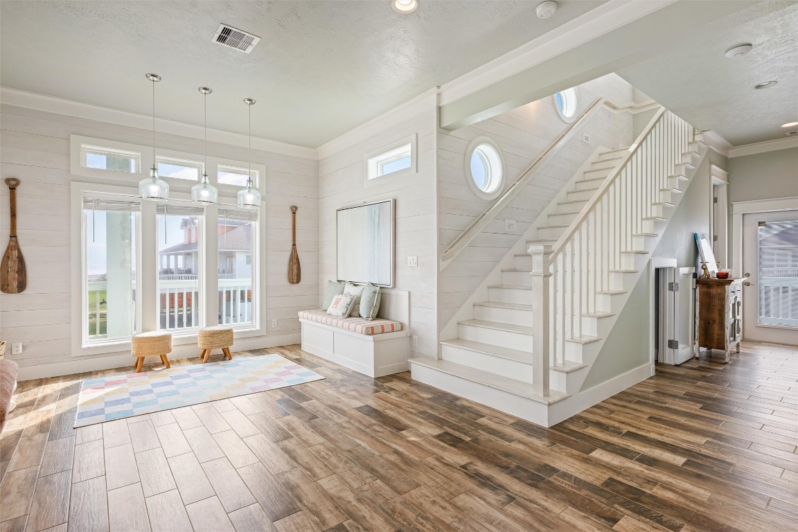 3116 James Street Crystal Beach, TX 77650 - Photo 22 of 47 a spacious bedroom with a large window and a wooden floor