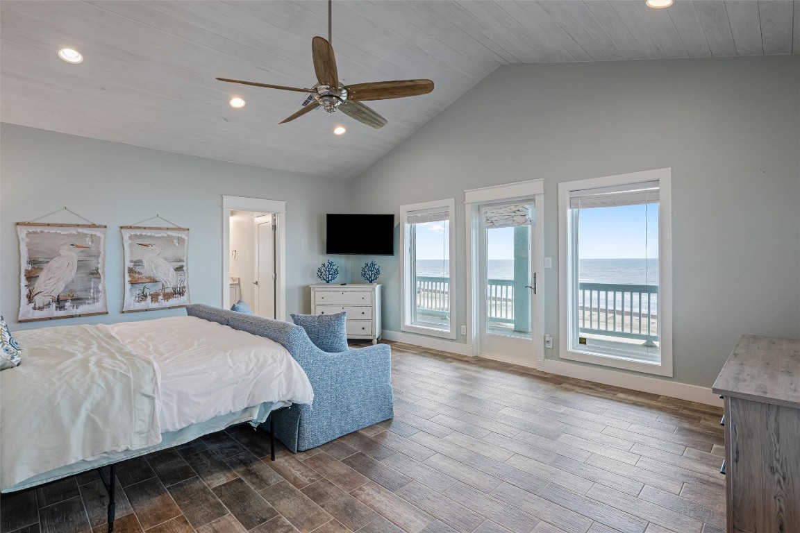 3116 James Street Crystal Beach, TX 77650 - Photo 29 of 47 a bedroom with a large bed and a tv