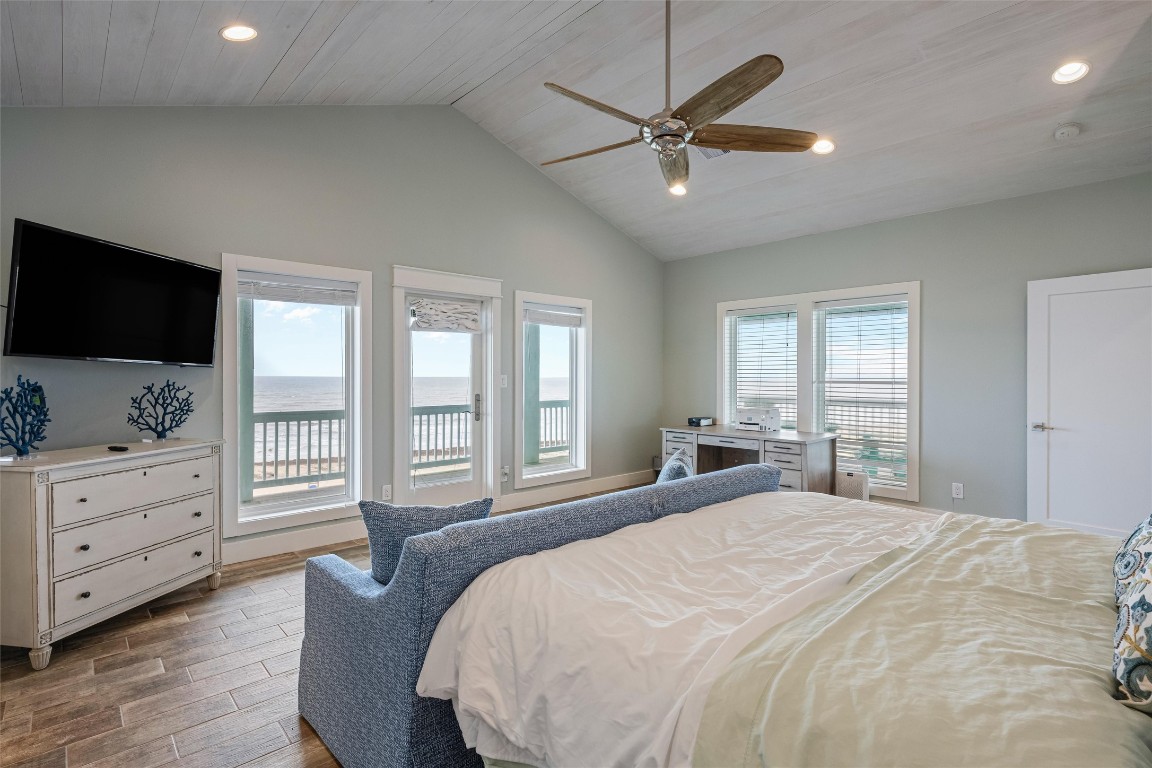 3116 James Street Crystal Beach, TX 77650 - Photo 31 of 47 a bedroom with a large bed and flat tv