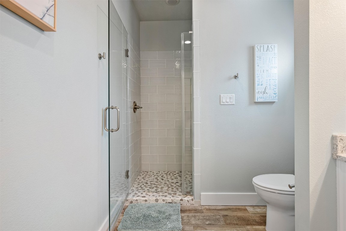 3116 James Street Crystal Beach, TX 77650 - Photo 33 of 47 a bathroom with a shower and a toilet