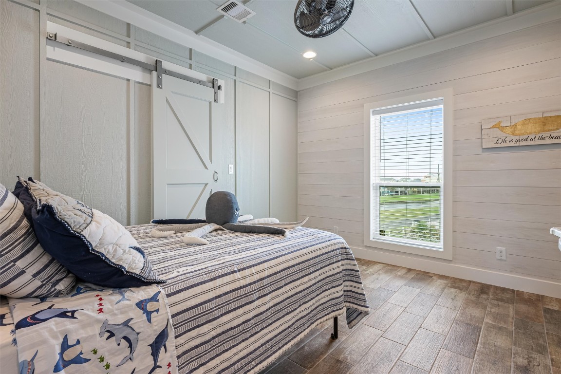 3116 James Street Crystal Beach, TX 77650 - Photo 39 of 47 a bed sitting in a bedroom next to a window