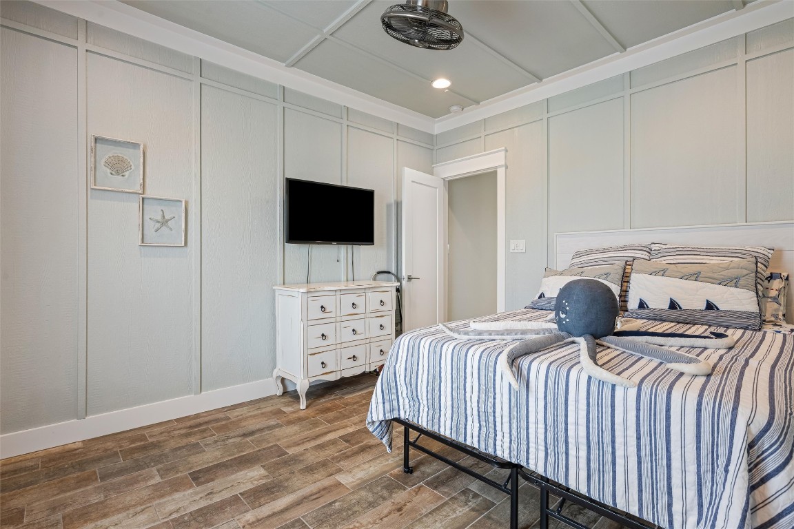 3116 James Street Crystal Beach, TX 77650 - Photo 40 of 47 a bedroom with a bed and a flat screen tv