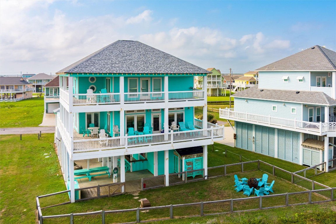 3116 James Street Crystal Beach, TX 77650 - Photo 4 of 47 a balcony with table and chairs