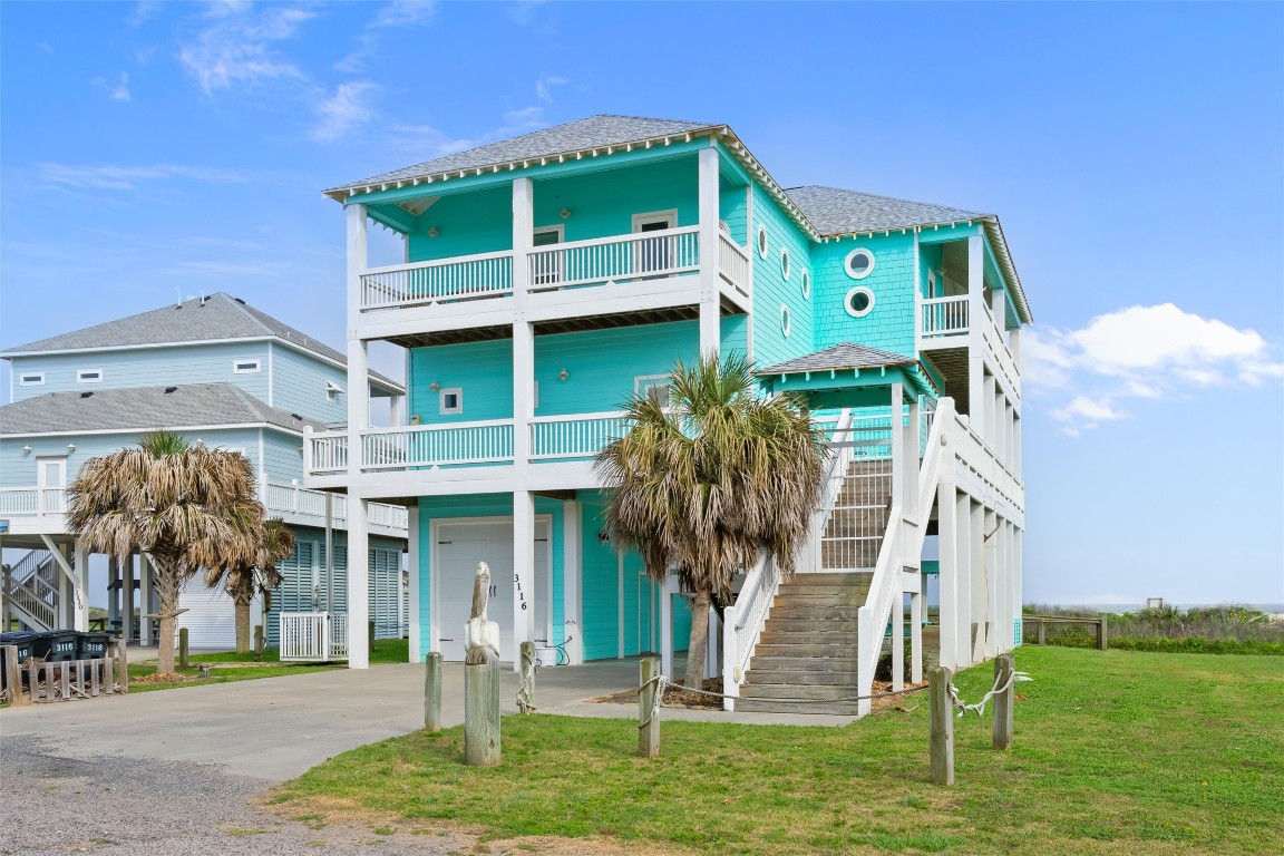 3116 James Street Crystal Beach, TX 77650 - Photo 5 of 47 a front view of a house with a yard