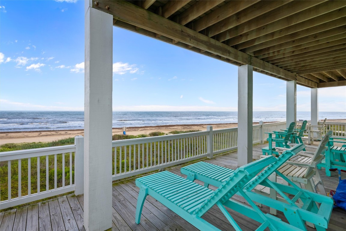 3116 James Street Crystal Beach, TX 77650 - Photo 6 of 47 a view of a balcony with a floor to ceiling window and wooden floor