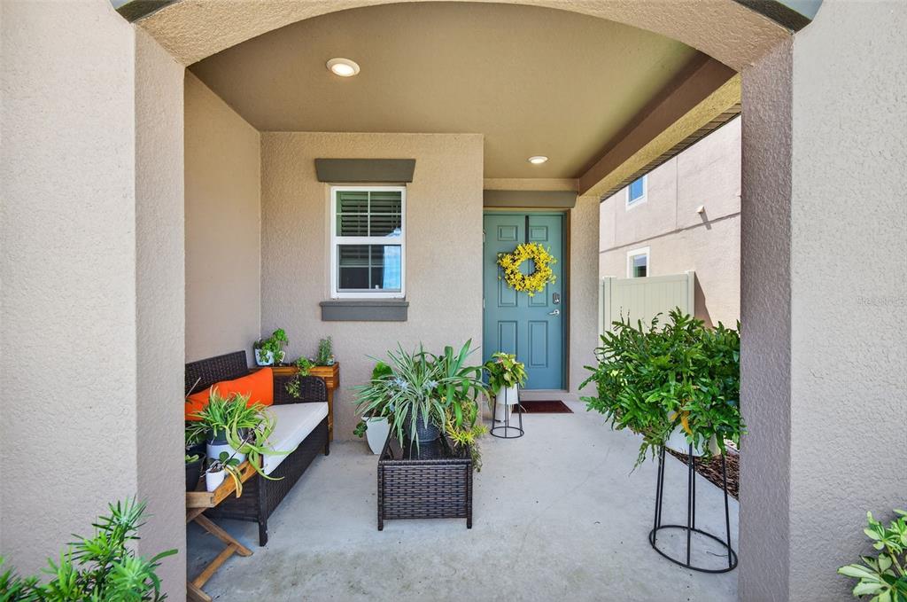 11120 Radiant Shore Loop San Antonio, FL 33576 - Photo 11 of 17 a potted plant sitting in front of a house