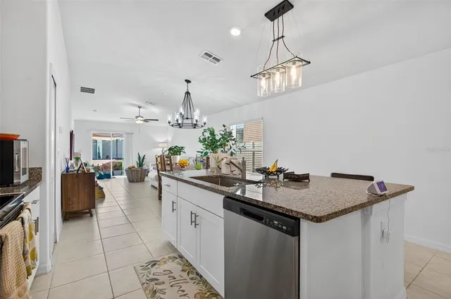 a kitchen with a counter space appliances and cabinets