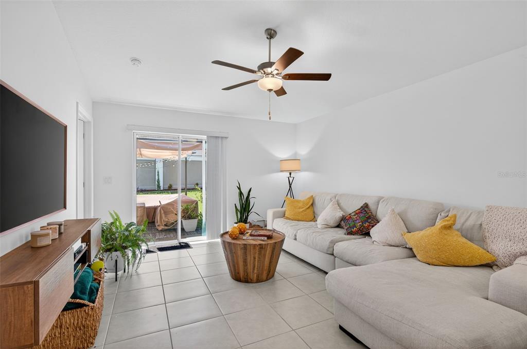 11120 Radiant Shore Loop San Antonio, FL 33576 - Photo 14 of 17 a living room with furniture and a flat screen tv