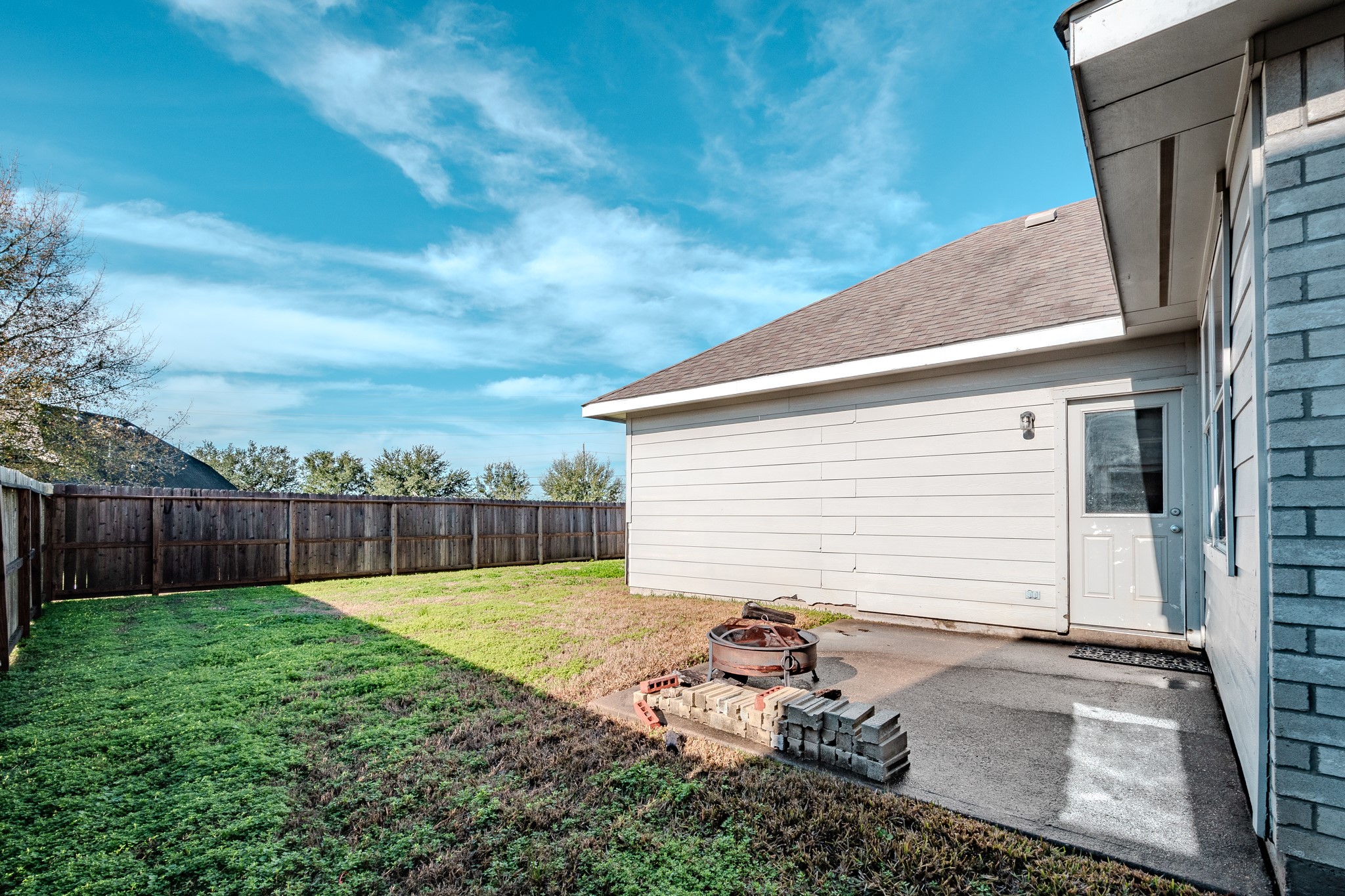 8515 Holly Spring Lane Baytown, TX 77523 - Photo 26 of 28 a view of a backyard with a garden