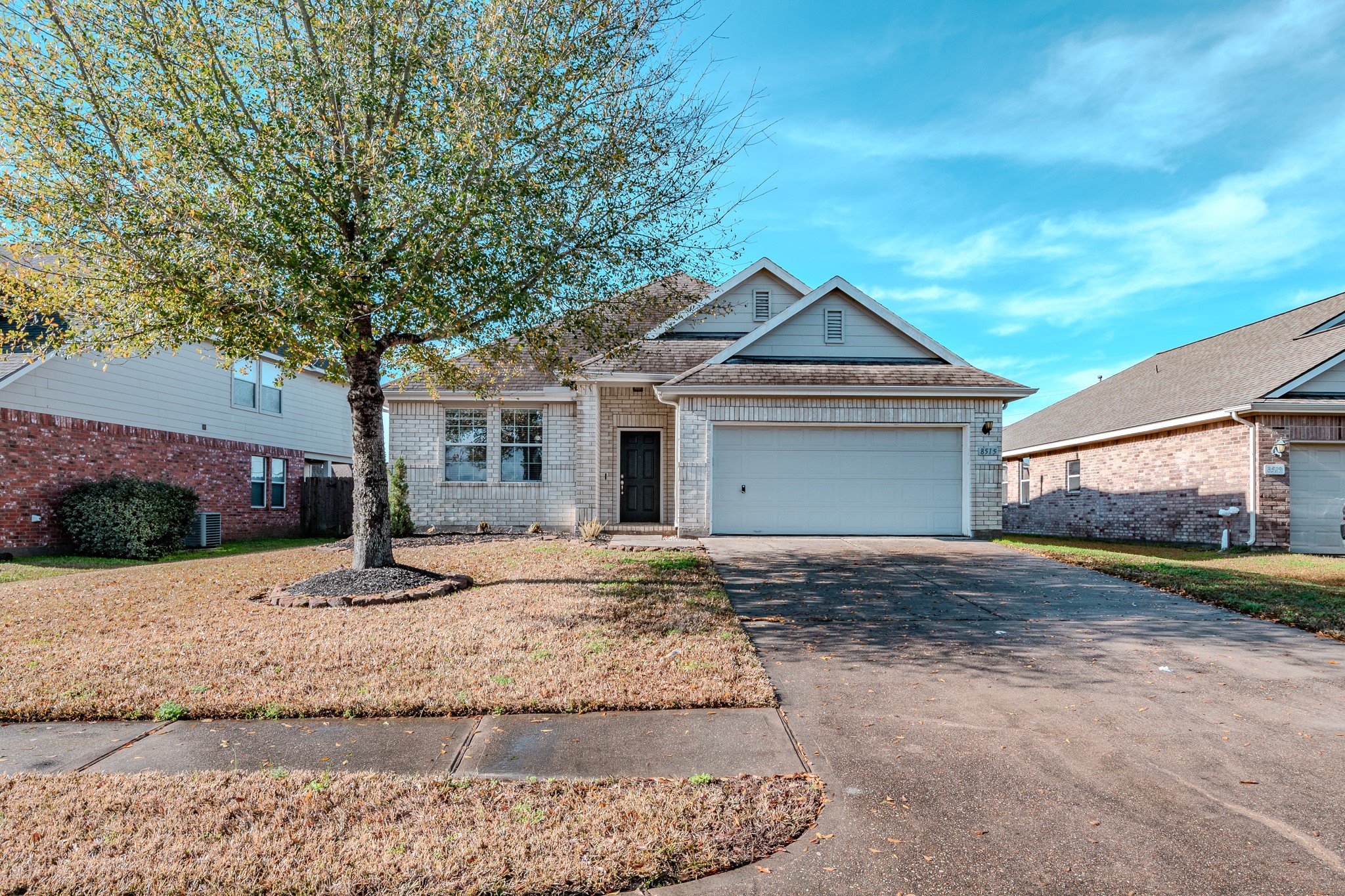 8515 Holly Spring Lane Baytown, TX 77523 - Photo 4 of 28 a front view of a house with a yard