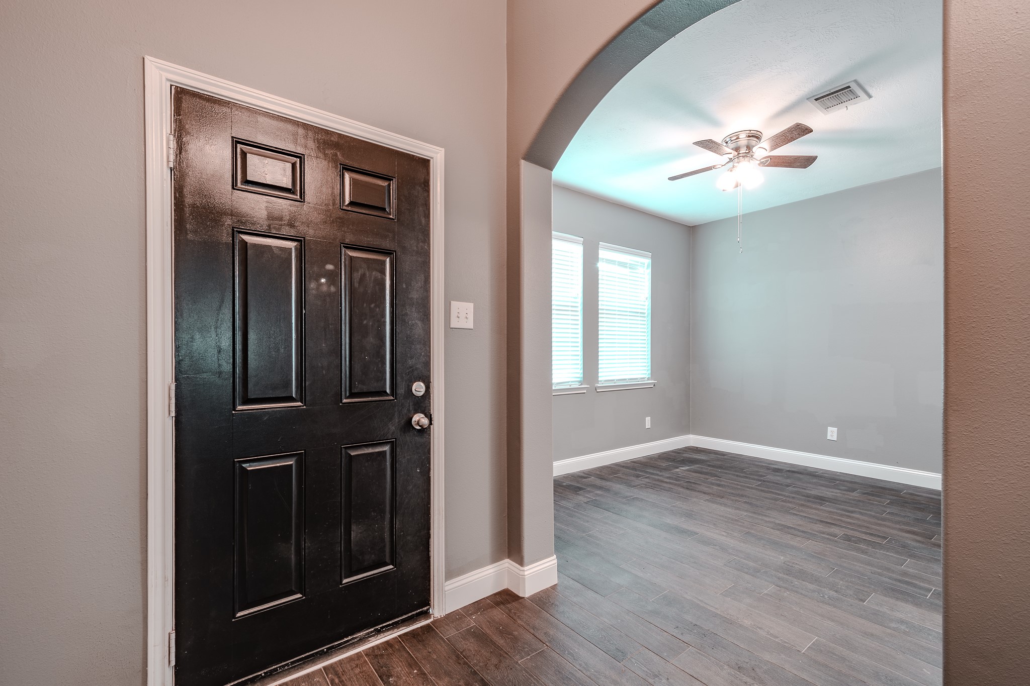 8515 Holly Spring Lane Baytown, TX 77523 - Photo 8 of 28 a view of a hallway with wooden floor