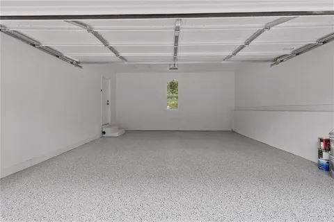 a view of a room with wooden floor and windows