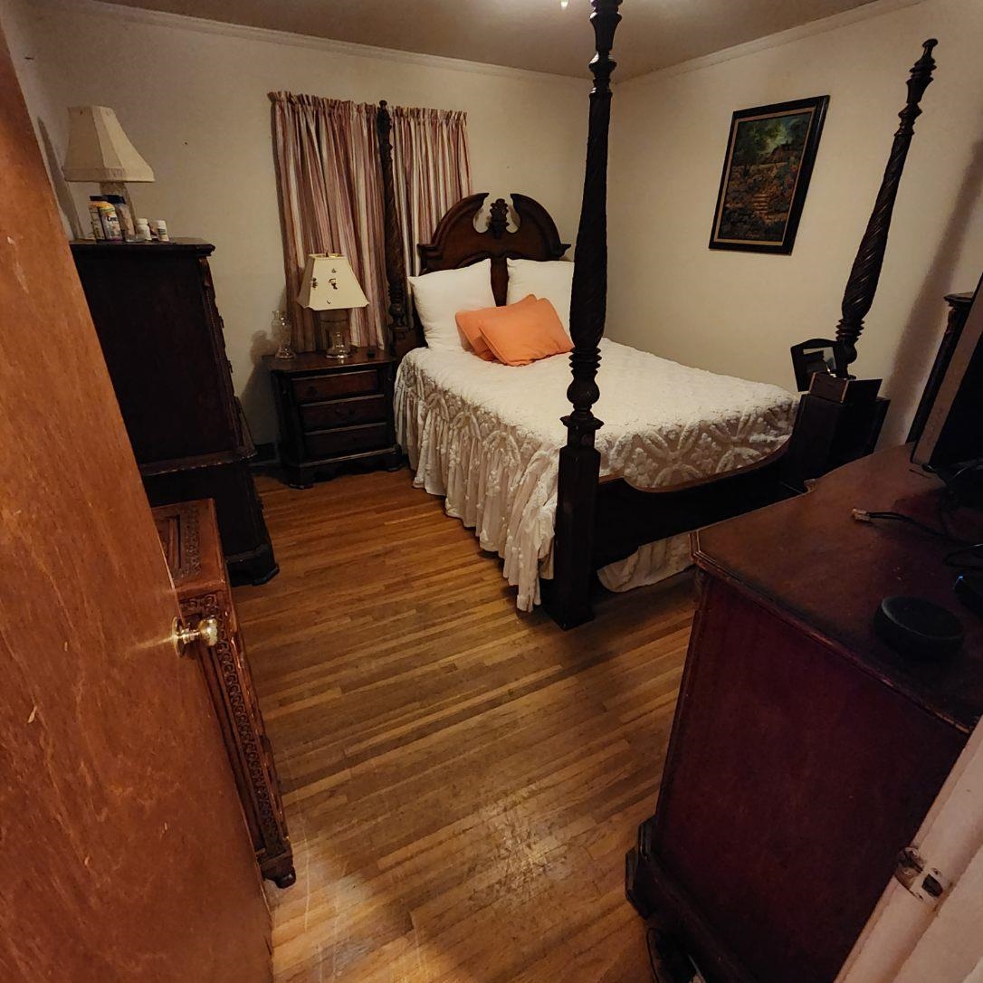 2951 Bannockburn Road Memphis, TN 38128 - Photo 15 of 18 a bedroom with a bed and wooden floor