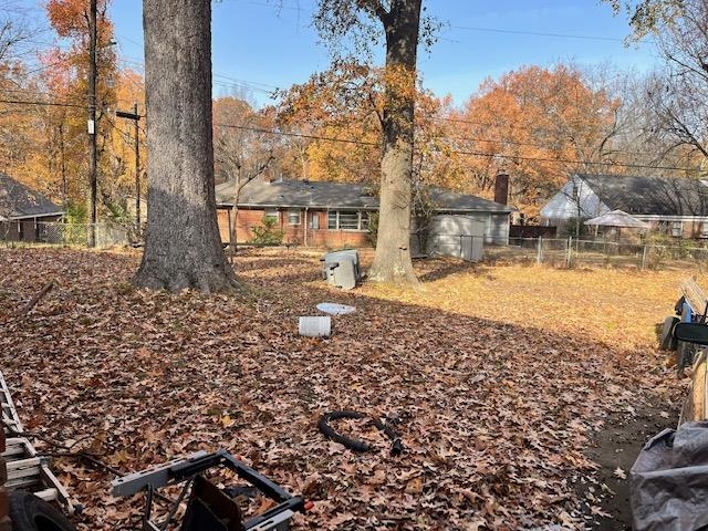 2951 Bannockburn Road Memphis, TN 38128 - Photo 18 of 18 a view of a yard with a house in the background