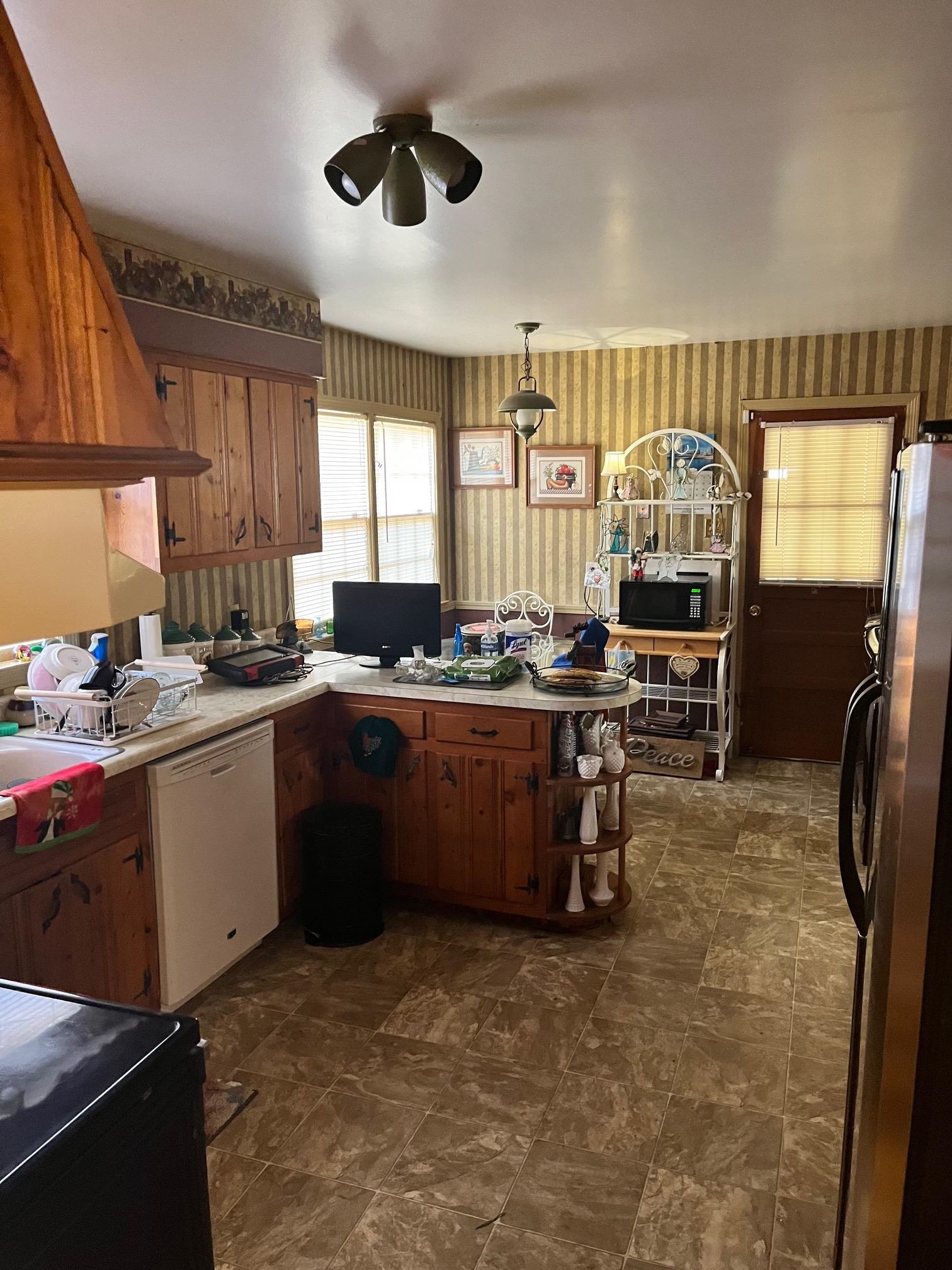 2951 Bannockburn Road Memphis, TN 38128 - Photo 7 of 18 a kitchen with a sink cabinets and window