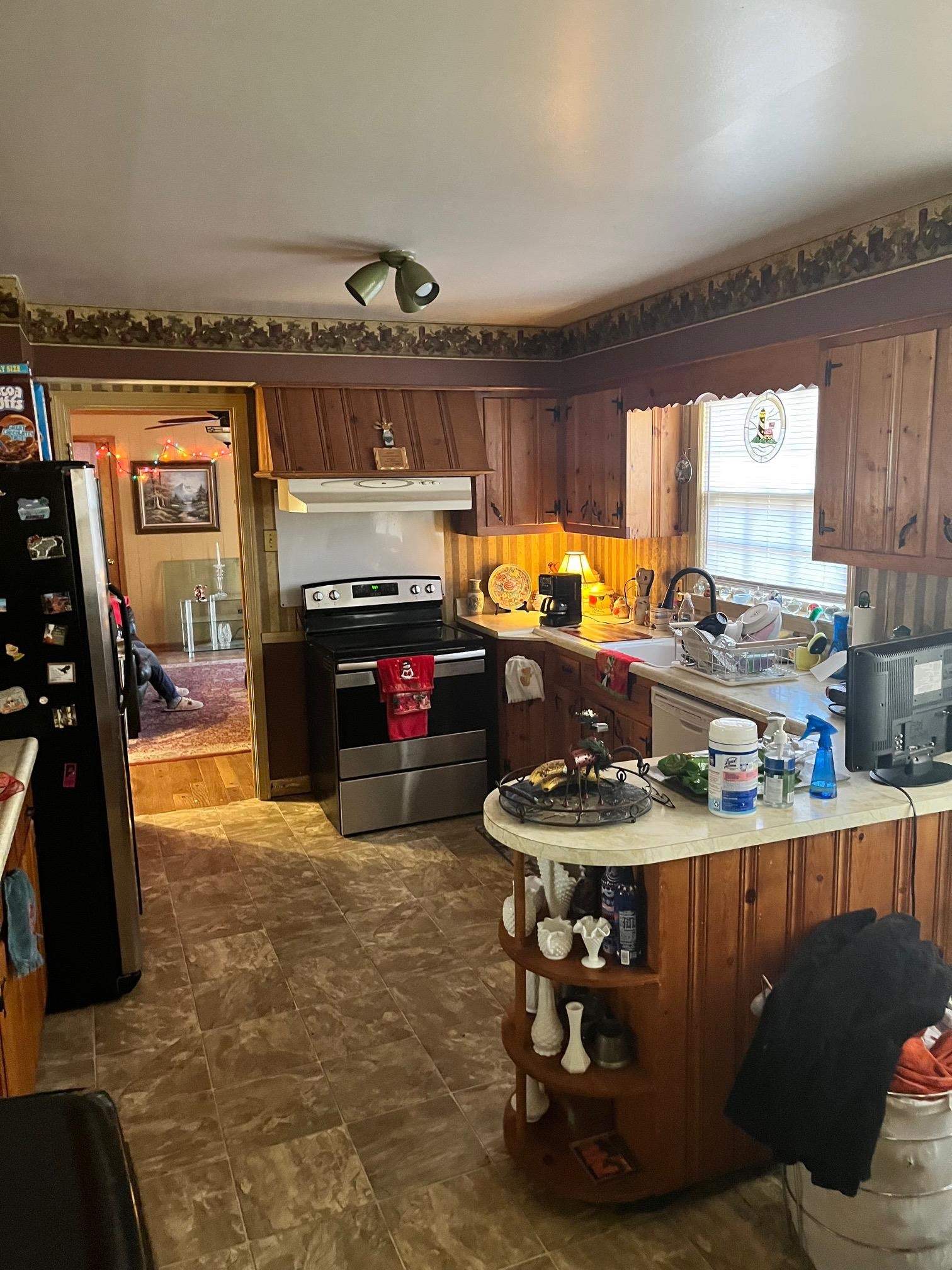 2951 Bannockburn Road Memphis, TN 38128 - Photo 8 of 18 a room with stainless steel appliances granite countertop a sink a stove and a refrigerator
