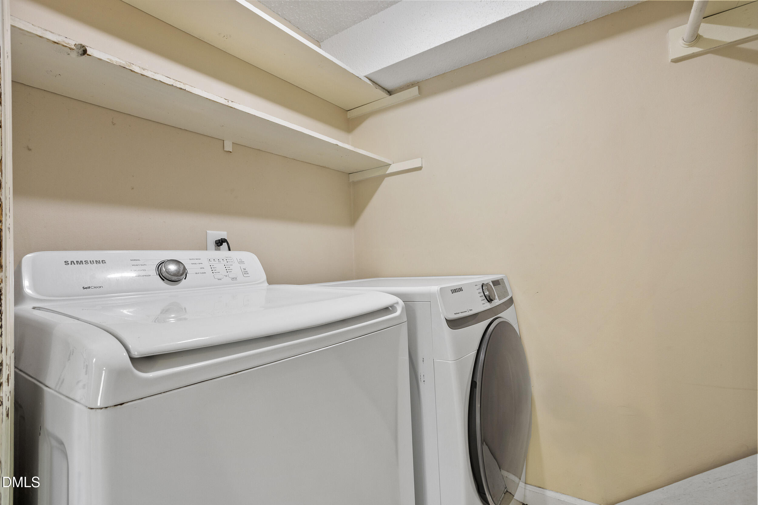 1801 Quail Ridge Road Raleigh, NC 27609 - Photo 25 of 29 a utility room with dryer and washer