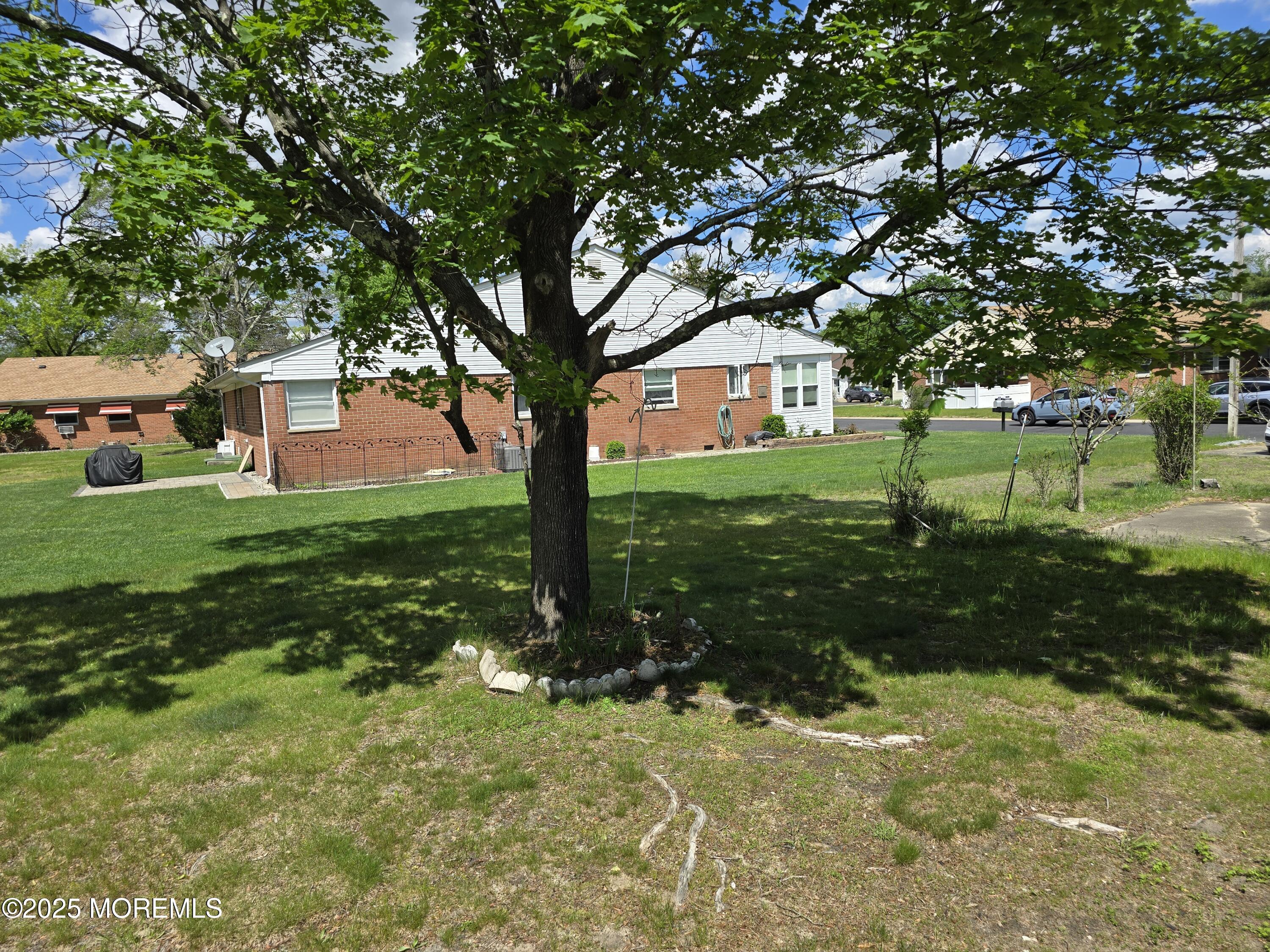 6 D Hancock Drive Whiting, NJ 08759 - Photo 4 of 12 a view of a yard with plants and trees