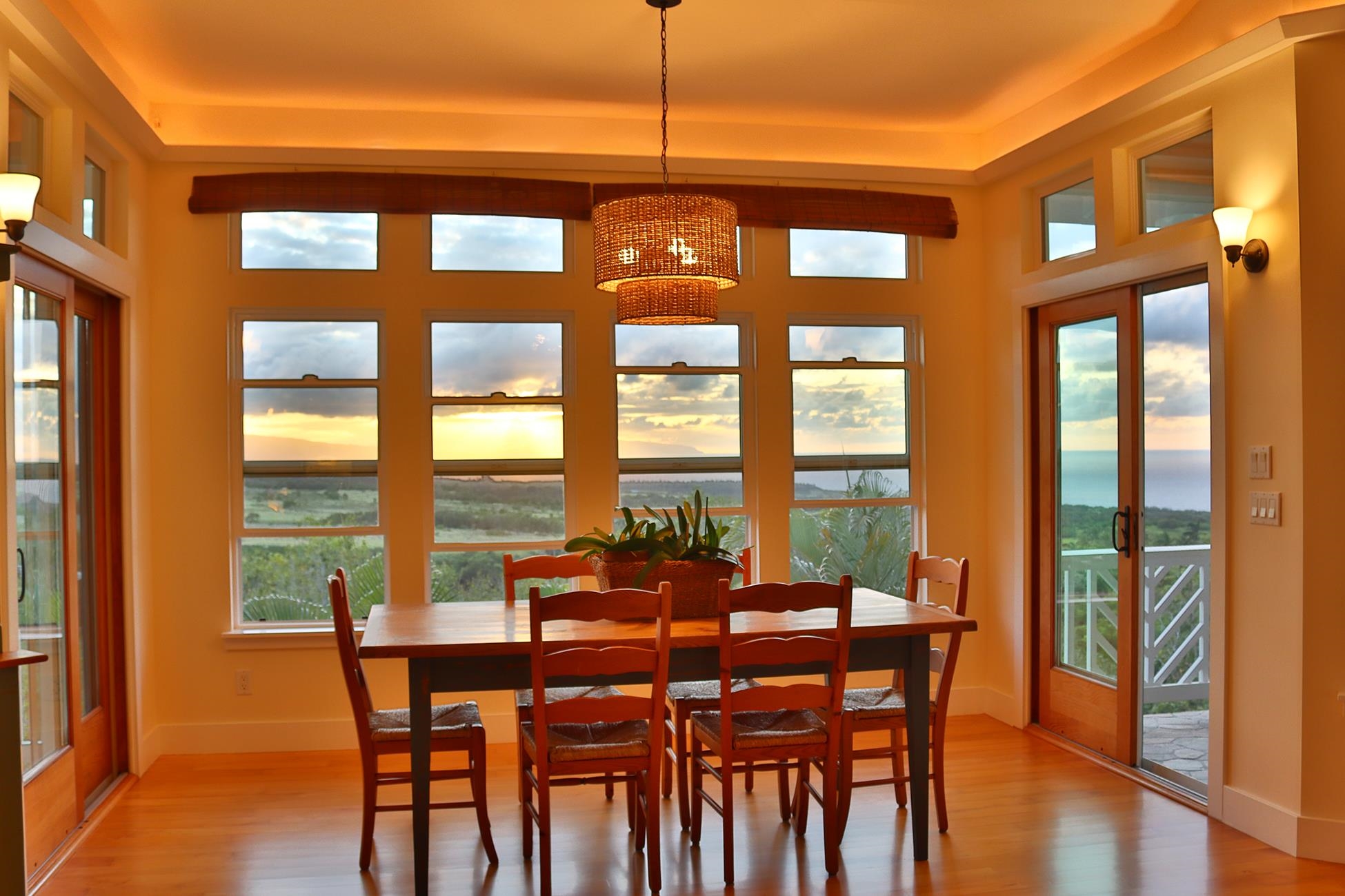 14 Lower Ulumalu Road Haiku, HI 96708 - Photo 18 of 50 a dining room with furniture a chandelier and wooden floor