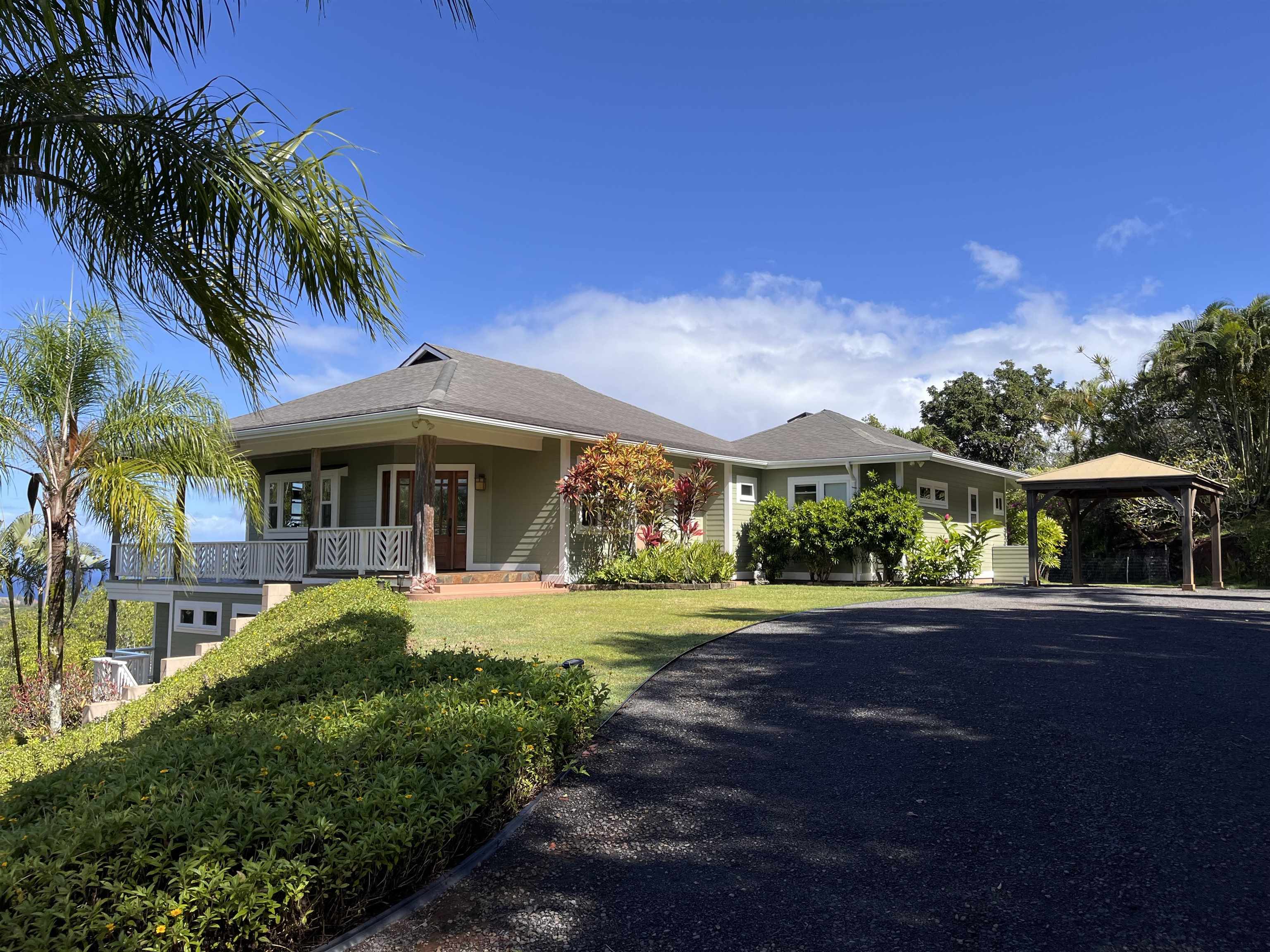 14 Lower Ulumalu Road Haiku, HI 96708 - Photo 2 of 50 a front view of a house with garden