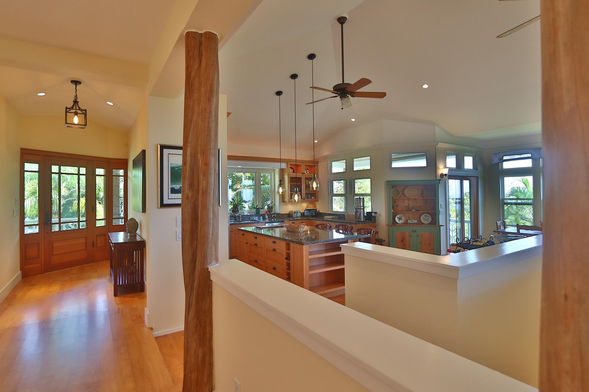 14 Lower Ulumalu Road Haiku, HI 96708 - Photo 26 of 50 a large living room with hardwood floor and a large window