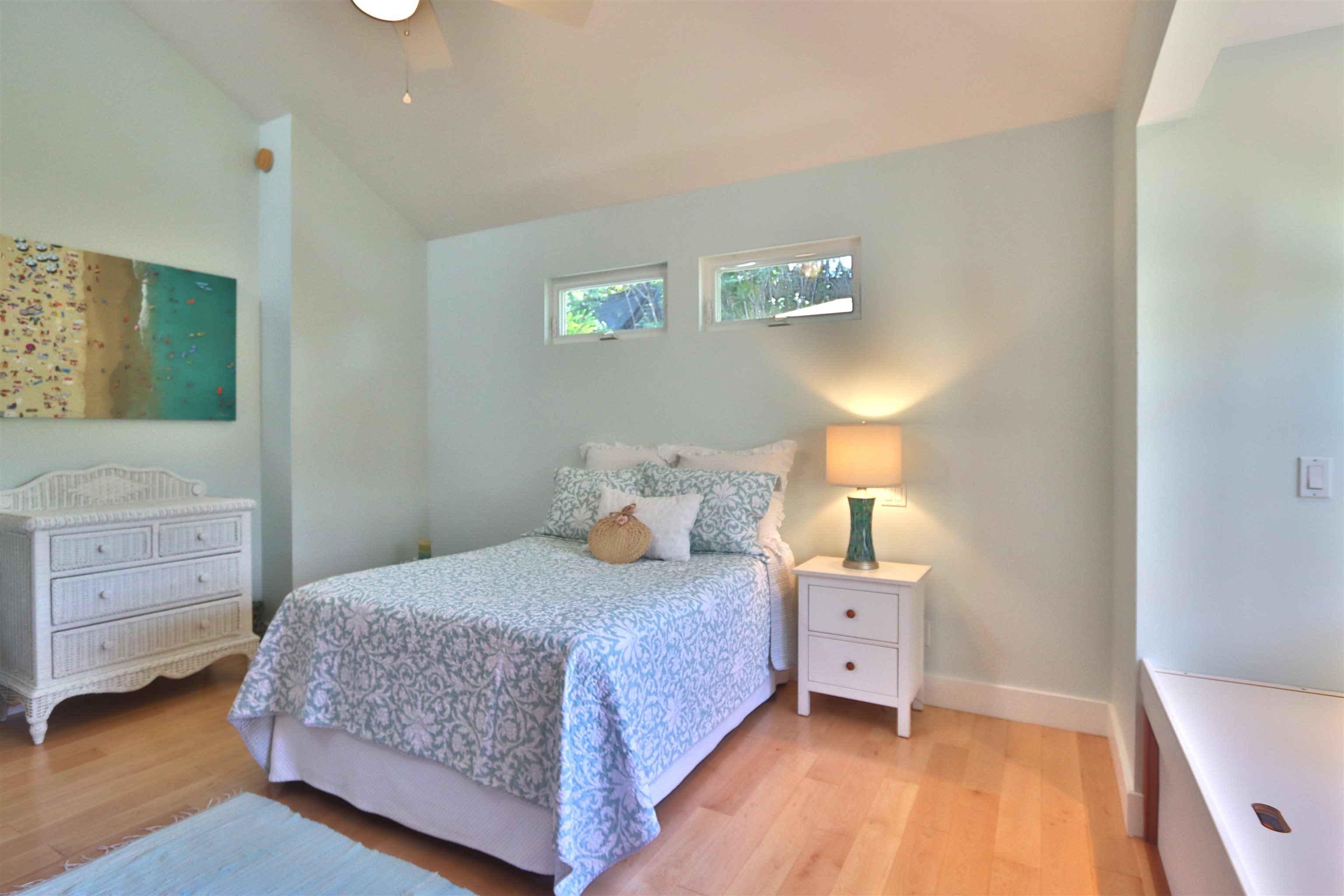 14 Lower Ulumalu Road Haiku, HI 96708 - Photo 27 of 50 a bedroom with a bed and a window