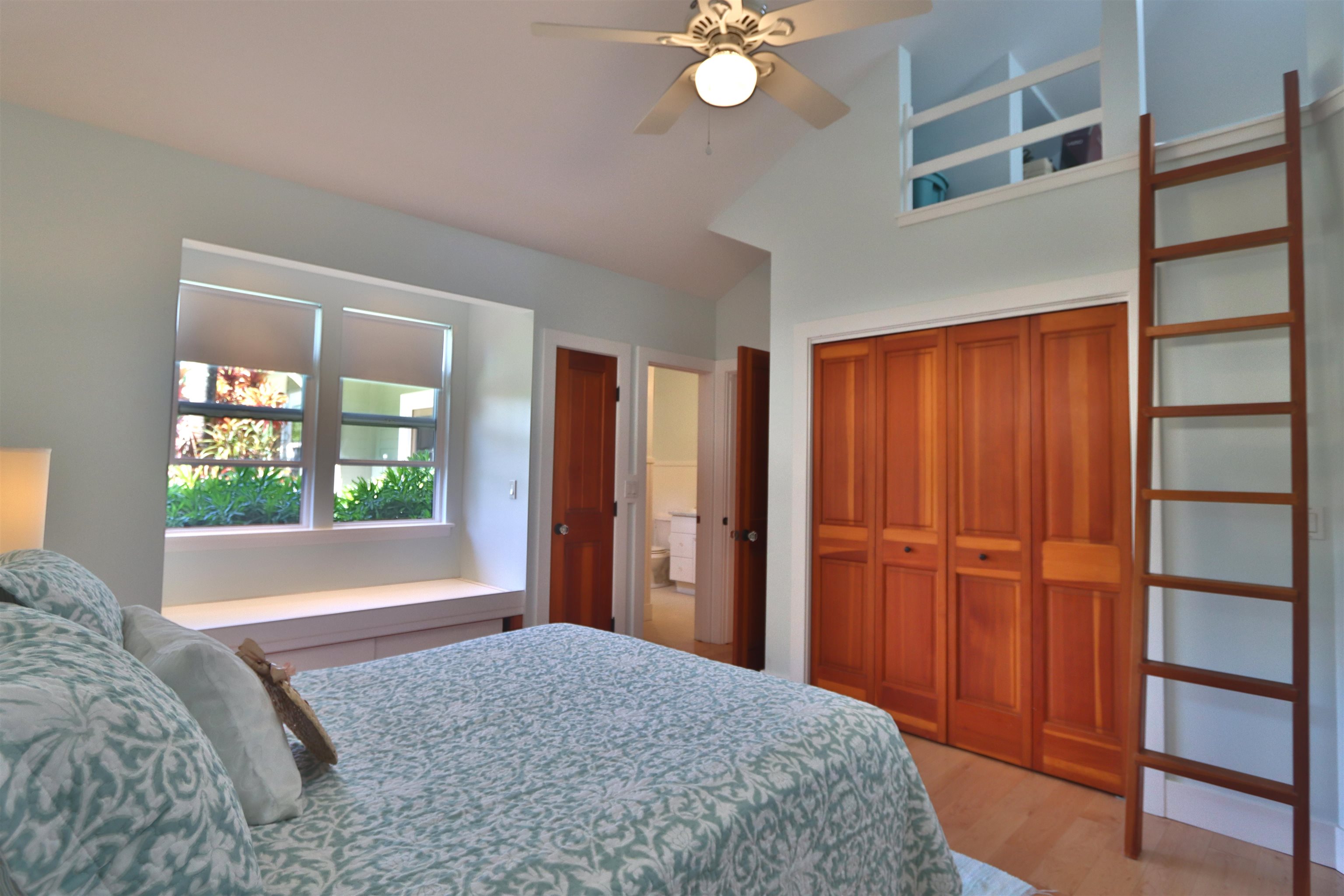 14 Lower Ulumalu Road Haiku, HI 96708 - Photo 29 of 50 a bedroom with a bed and a window