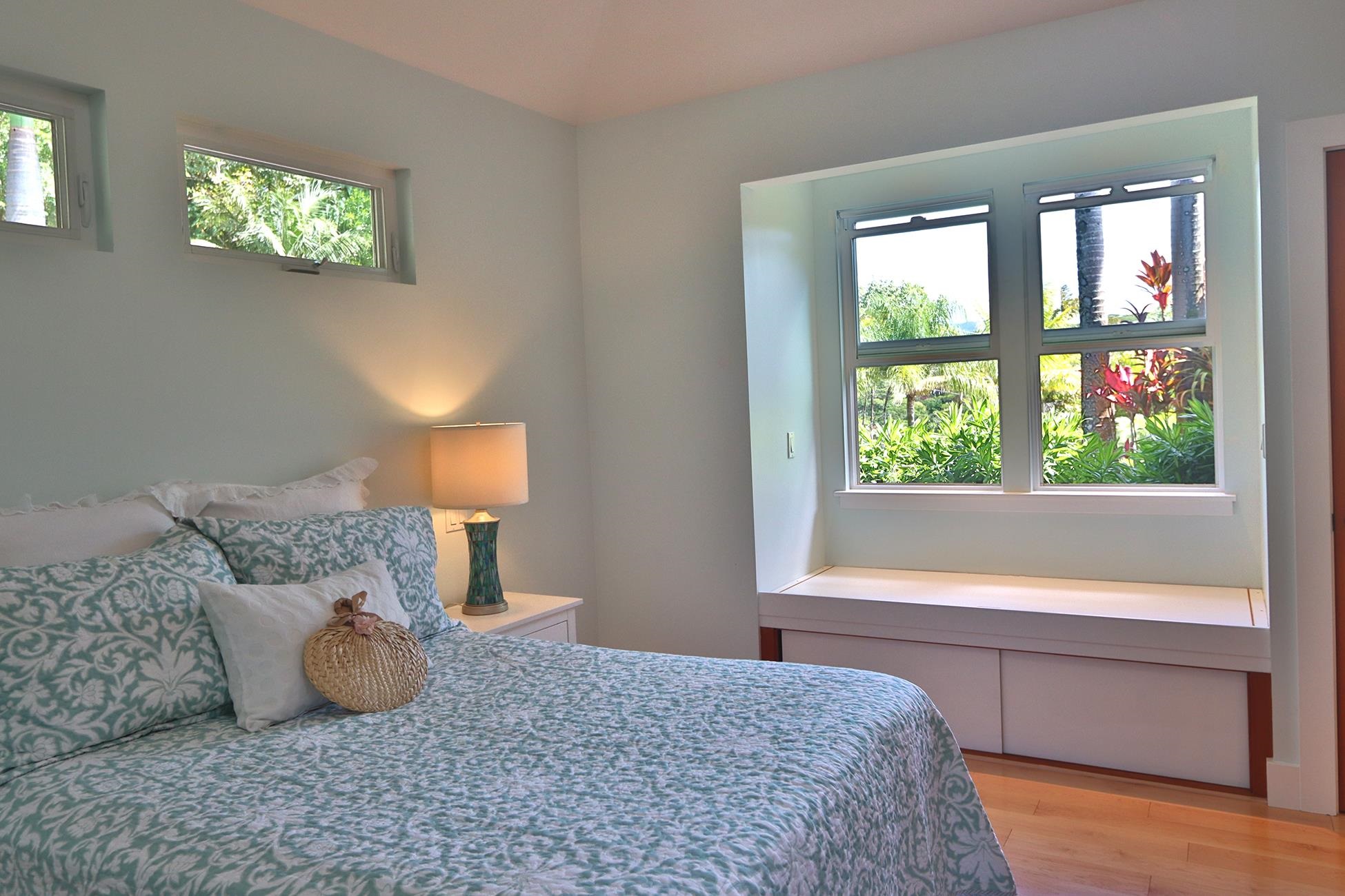 14 Lower Ulumalu Road Haiku, HI 96708 - Photo 31 of 50 a bedroom with a bed and a window