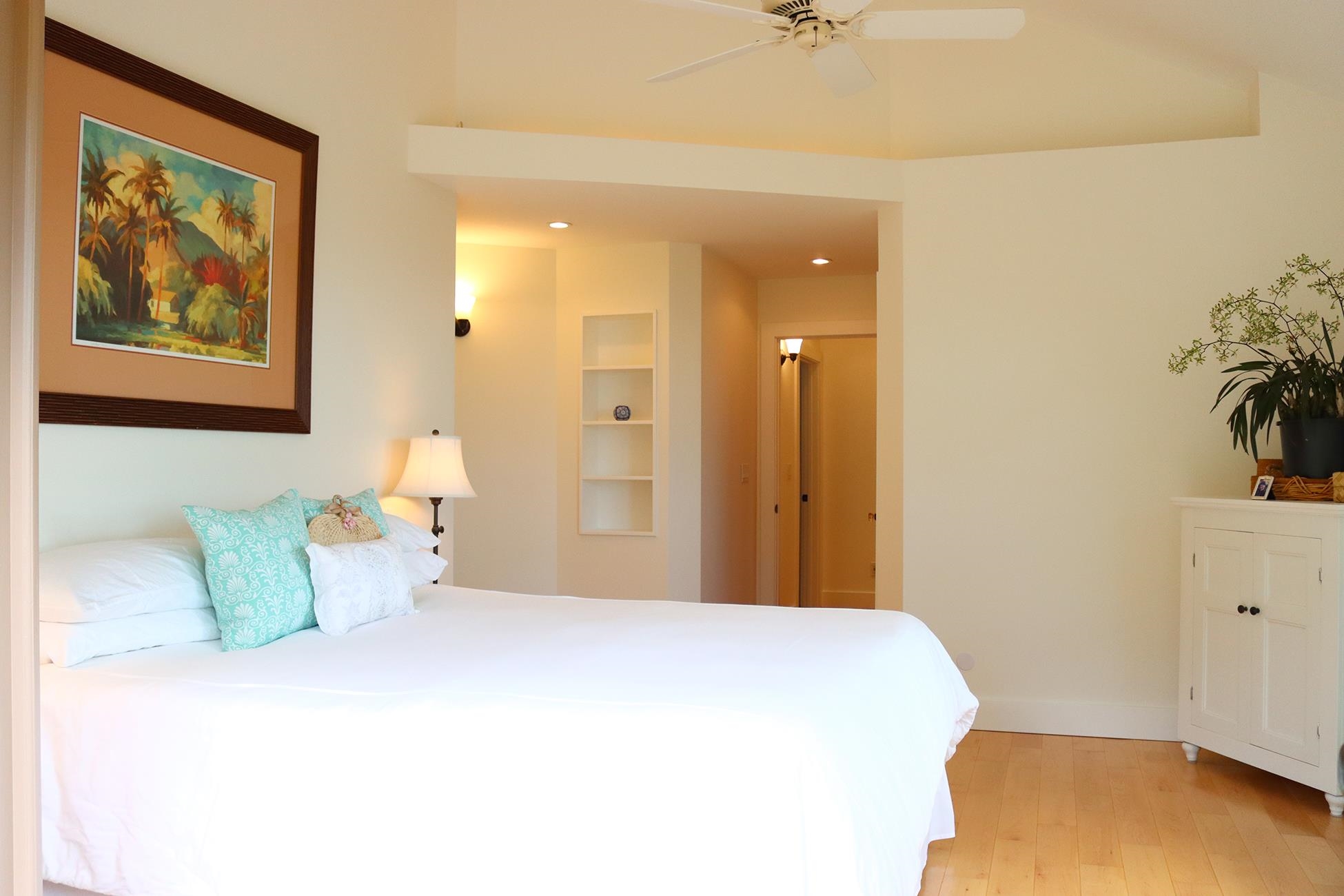 14 Lower Ulumalu Road Haiku, HI 96708 - Photo 37 of 50 a bedroom with a bed and a cabinets