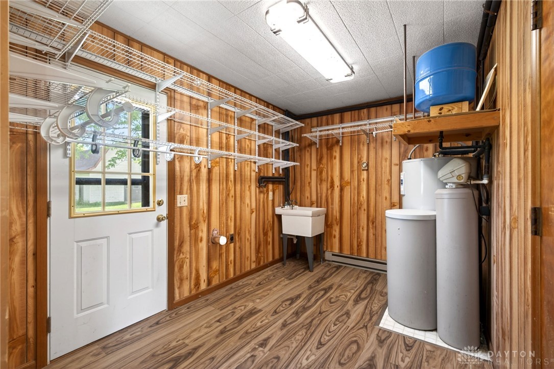1005 Free Road New Carlisle, OH 45344 - Photo 10 of 43 This functional utility room offers ample storage and essential systems for efficient home management.