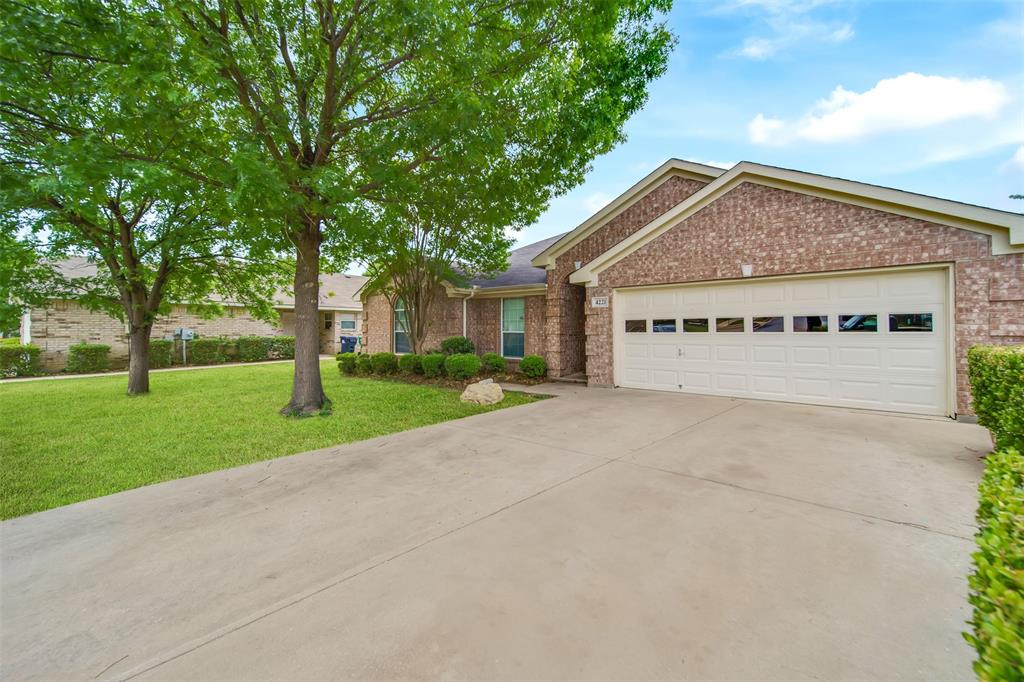 4221 Fiste Denton, TX 76207 - Photo 3 of 26 Ranch-style home with a garage and a front lawn
