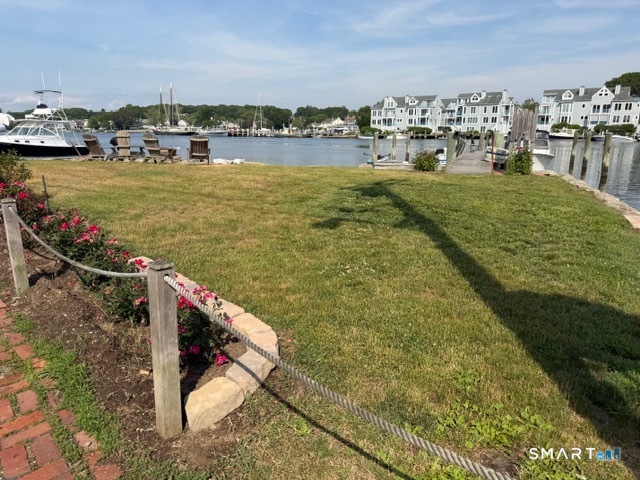 14 Pearl Street Groton, CT 06355 - Photo 2 of 2 Bonus riverfront lawn area just steps from the house. 6 Adirondack chairs, fire pit, and possible dockage.