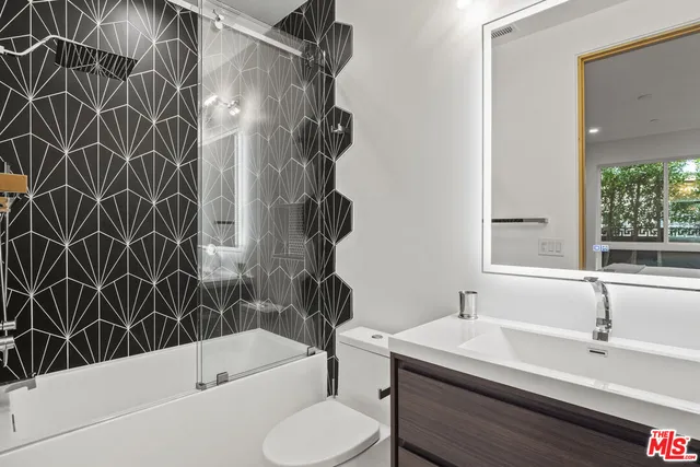 a bathroom with a sink toilet and bathtub