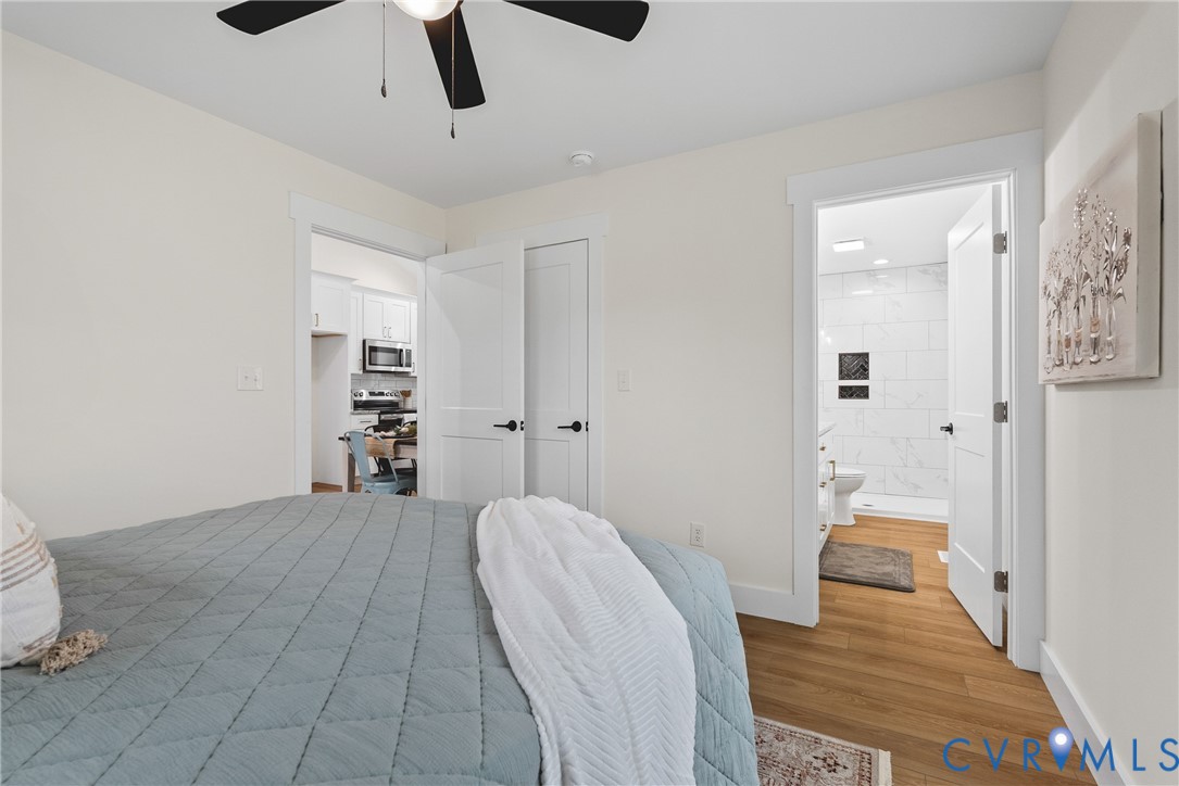 601 Mill Pond Drive Ruther Glen, VA 22546 - Photo 18 of 32 a bedroom with a bed and a view of bathroom