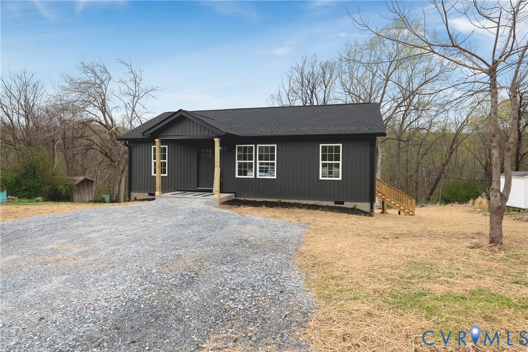 601 Mill Pond Drive Ruther Glen, VA 22546 - Photo 2 of 32 a house with trees in the background