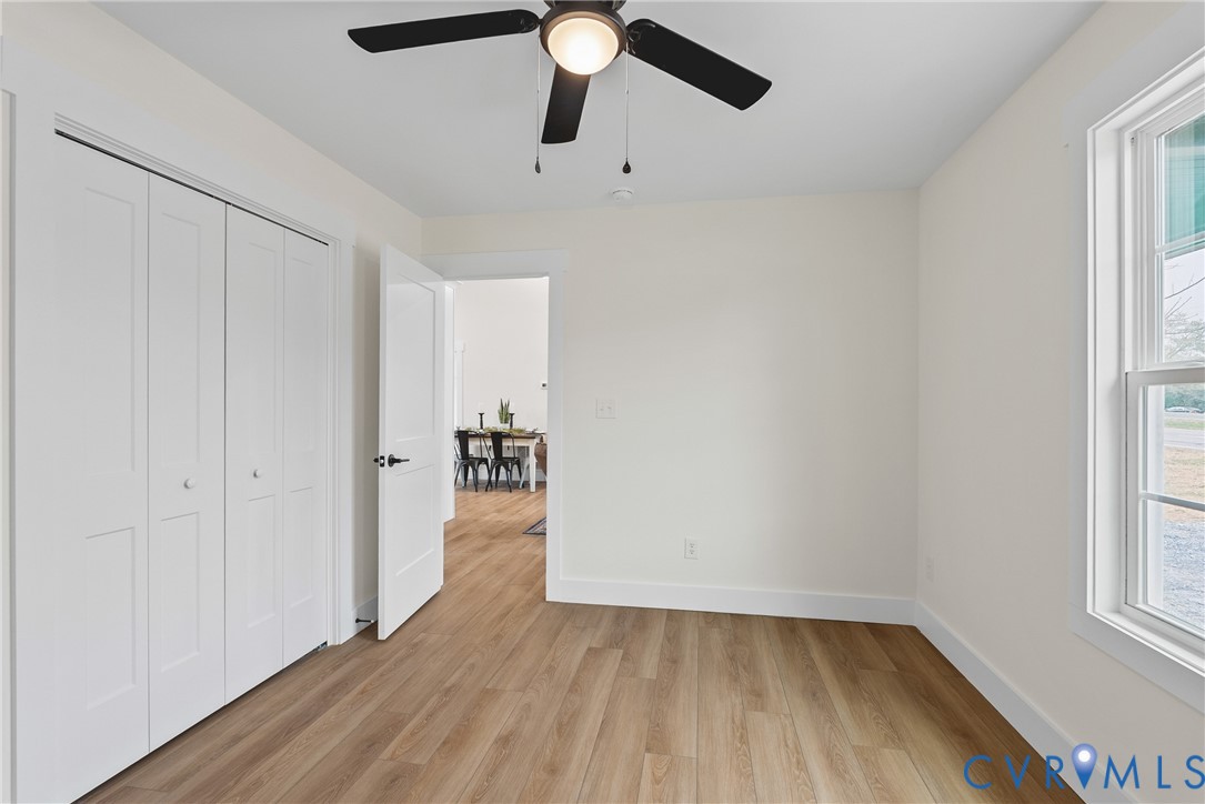 601 Mill Pond Drive Ruther Glen, VA 22546 - Photo 28 of 32 wooden floor in an empty room with a window