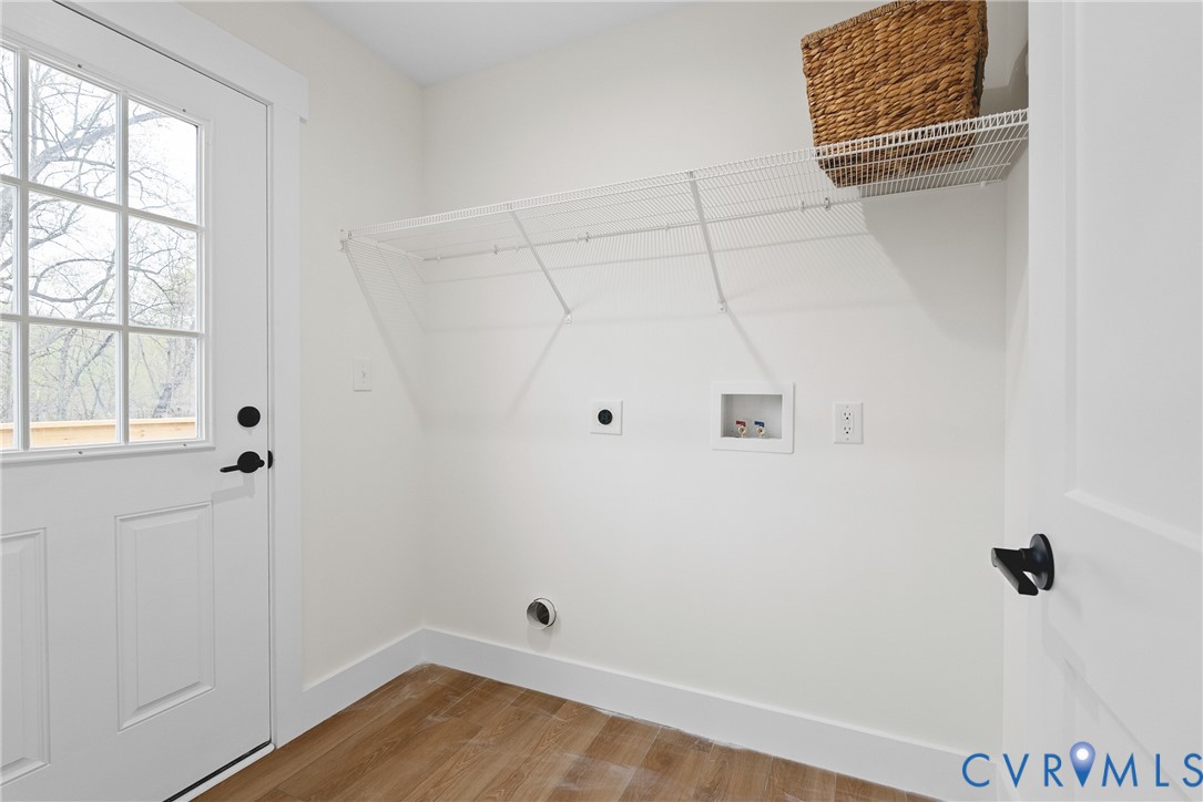 601 Mill Pond Drive Ruther Glen, VA 22546 - Photo 30 of 32 a view of a room with wooden floor and windows