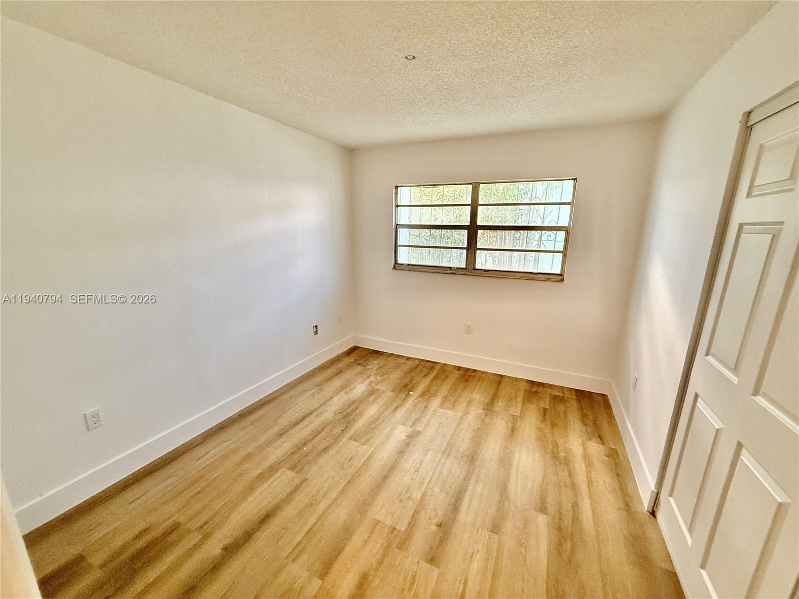 617 Northwest 10th Street Miami, FL 33136 - Photo 15 of 29 wooden floor in a room