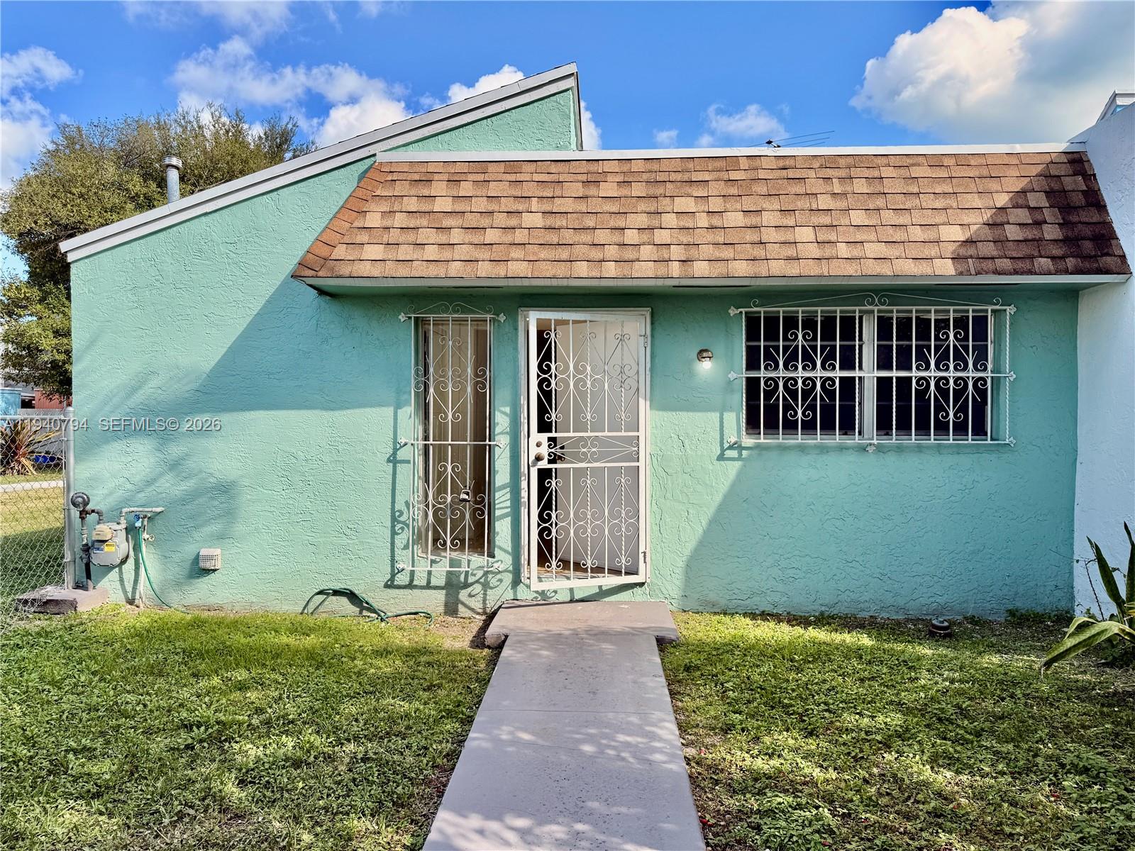 617 Northwest 10th Street Miami, FL 33136 - Photo 2 of 29 a front view of a house