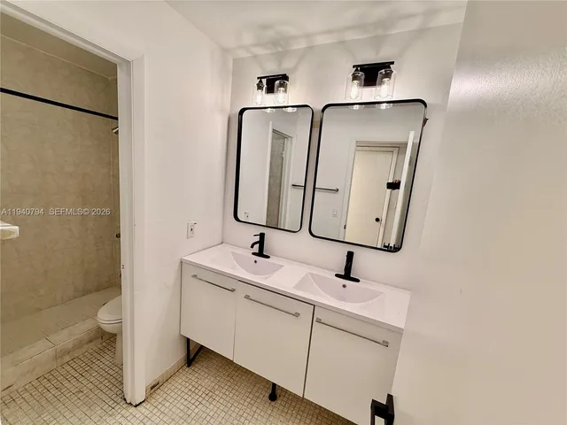 view of a bathroom with a sink and mirror