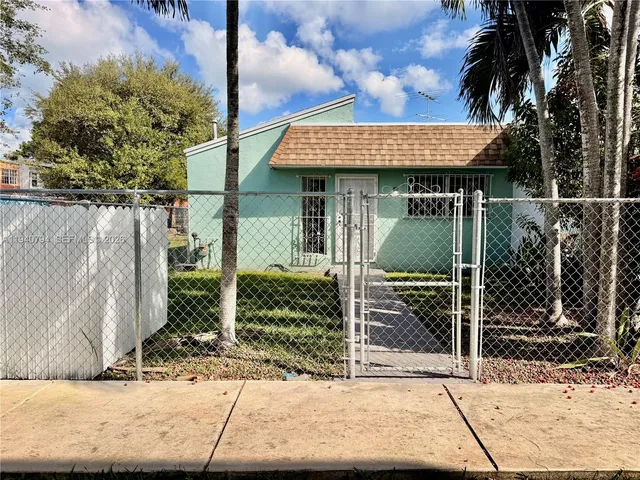 a view of a room with wooden floor and entryway