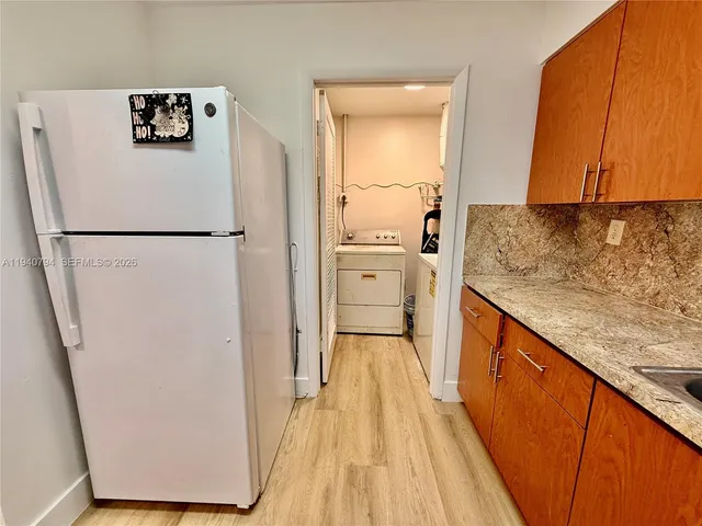 a bathroom with a double vanity sink toilet and mirror