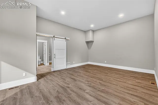 a spacious bathroom with a tub sink shower and mirror